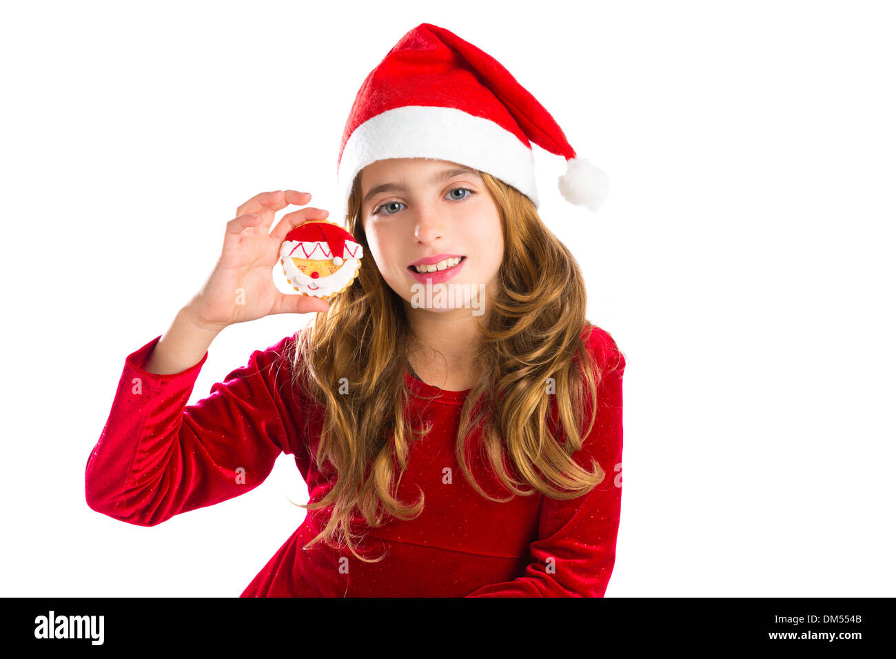 Christmas Santa cookie and Xmas dress kid girl isolated on white background Stock Photo