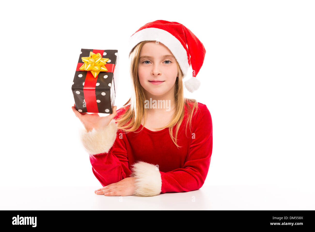 Christmas Santa blond kid girl happy excited with ribbon gift isolated on white background Stock Photo