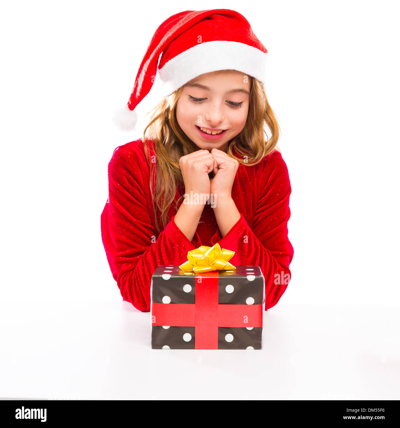 Christmas Santa kid girl happy excited with ribbon gift isolated on white background Stock Photo