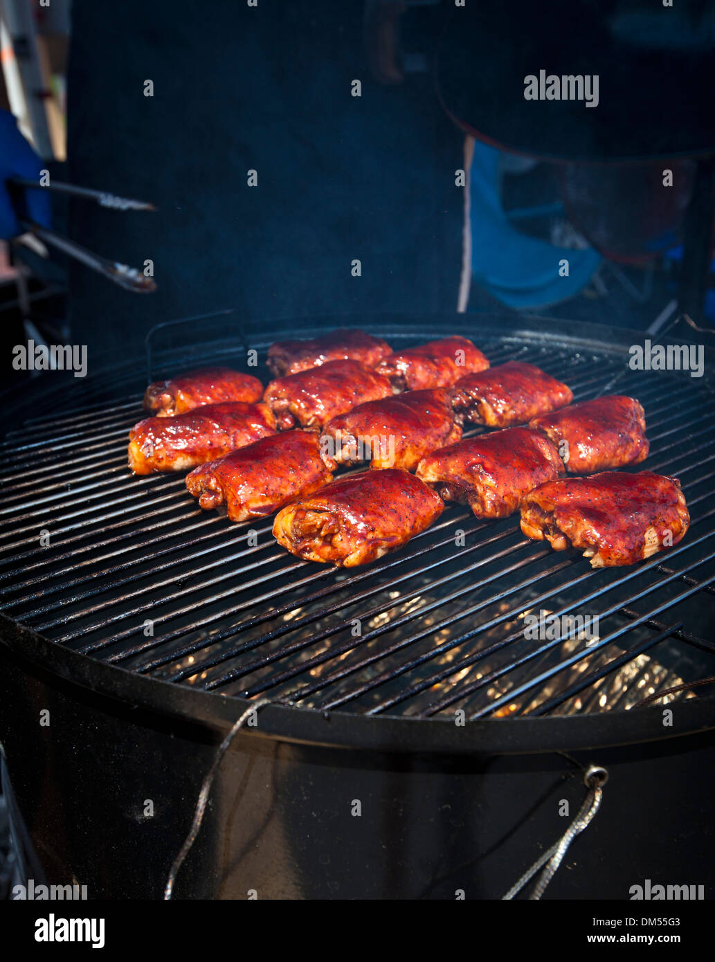 BBQ chicken thighs on a smoker Stock Photo Alamy