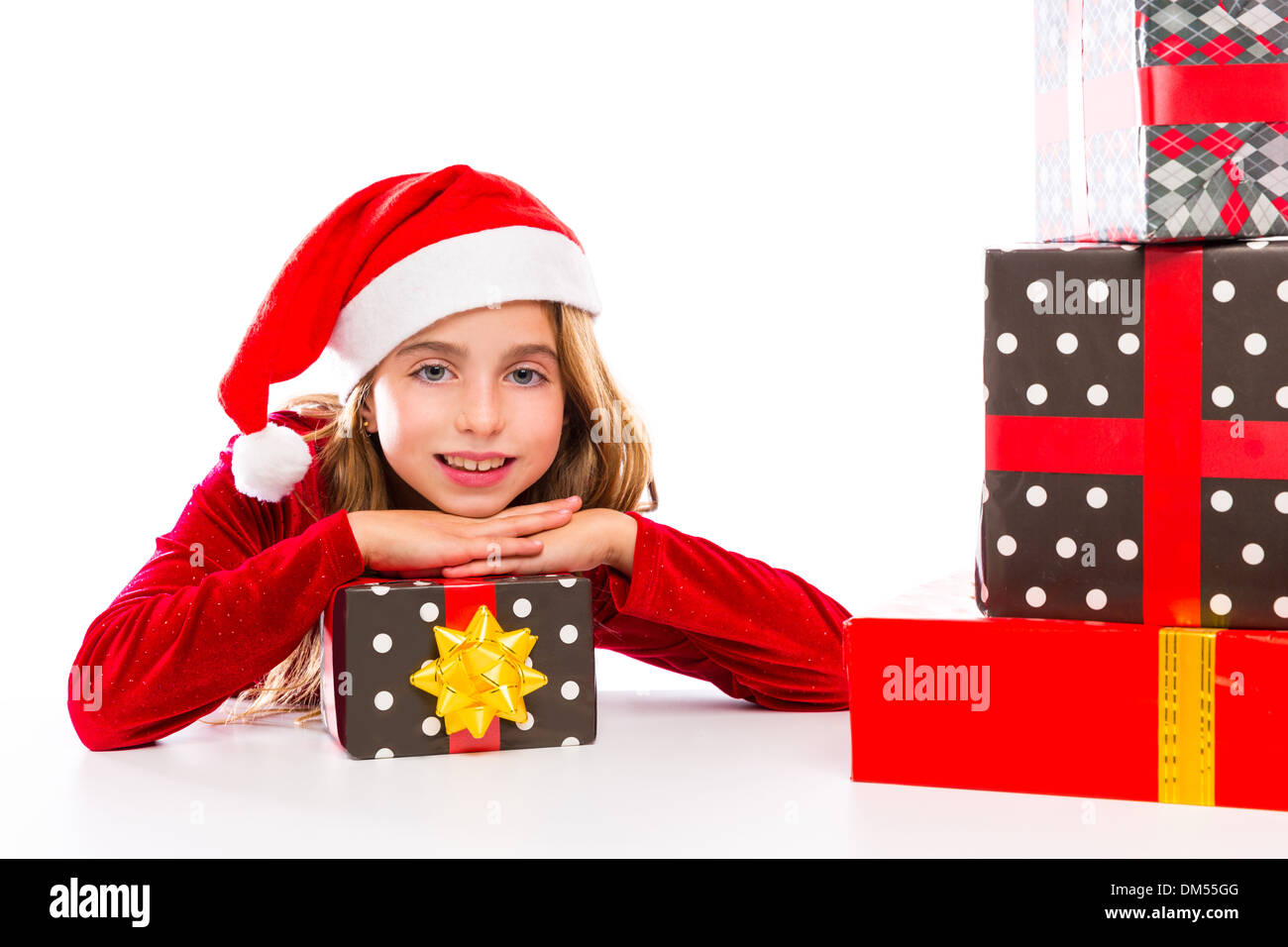 Christmas Santa kid girl happy excited with ribbon gifts isolated on white background Stock Photo