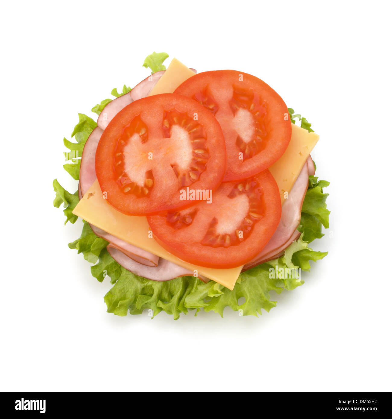 Healthy open sandwich with lettuce, tomato, smoked ham and cheese