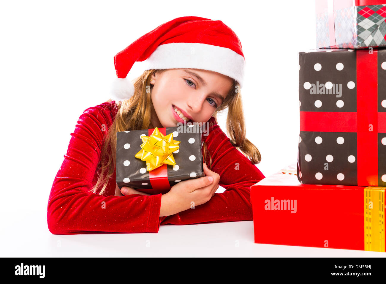 Christmas Santa kid girl happy excited with ribbon gifts isolated on white background Stock Photo