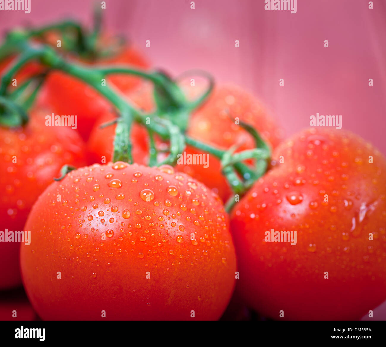 Fresh red tomatoes on a table top Stock Photo - Alamy