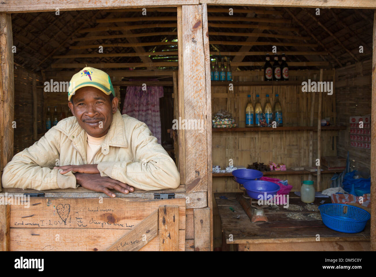 A man in his shop window in Fenerive Est District, Madagascar. Stock Photo