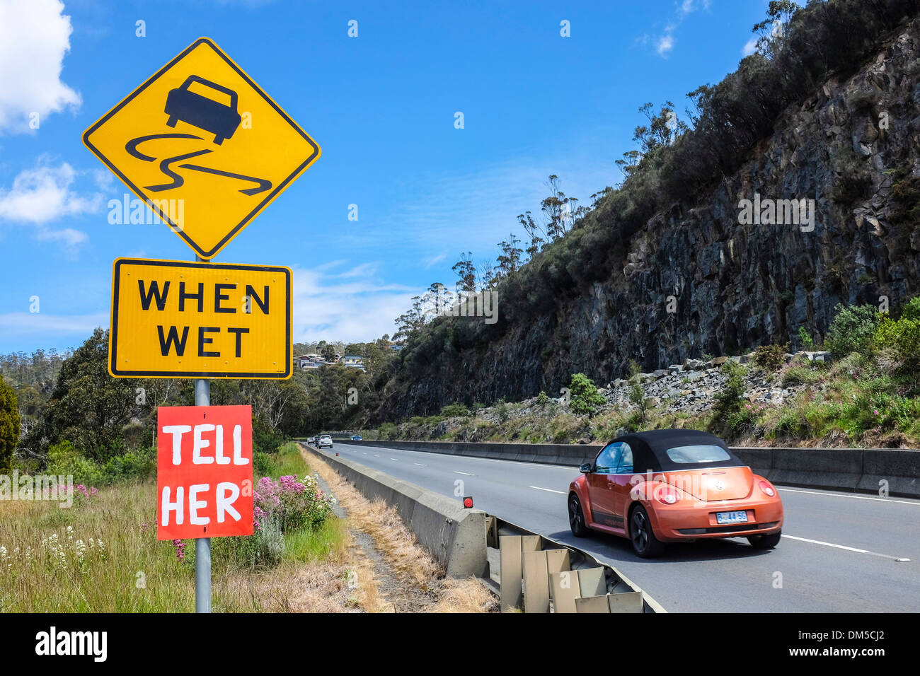 Enigmatic sign on a post by the highway suggesting perhaps a romantic affair. Stock Photo