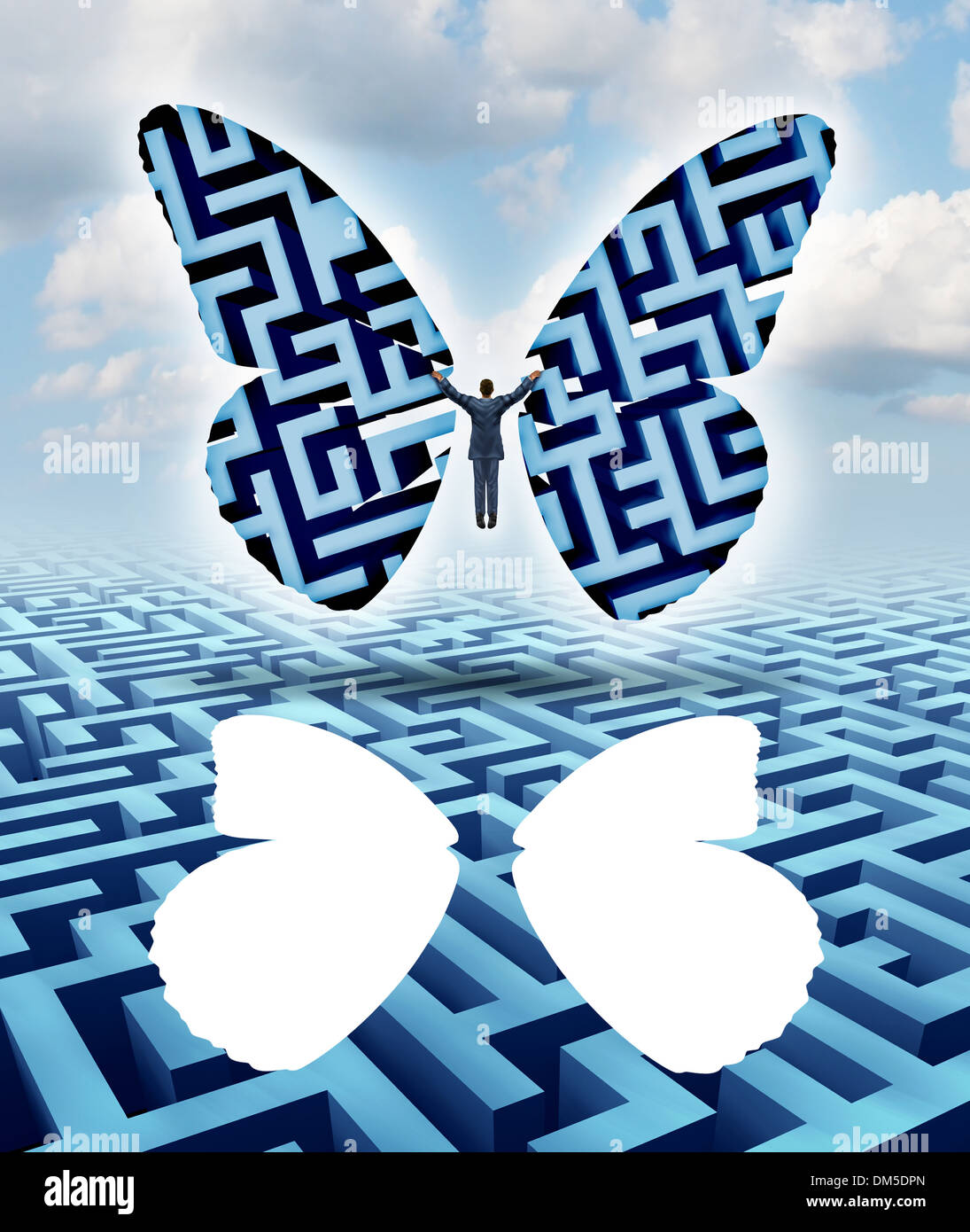 Freedom and creativity as an innovative businessman thinking outside the box escaping a maze or labyrinth by cutting out butterfly wings and taking flight overcoming adversity towards his journey to success. Stock Photo