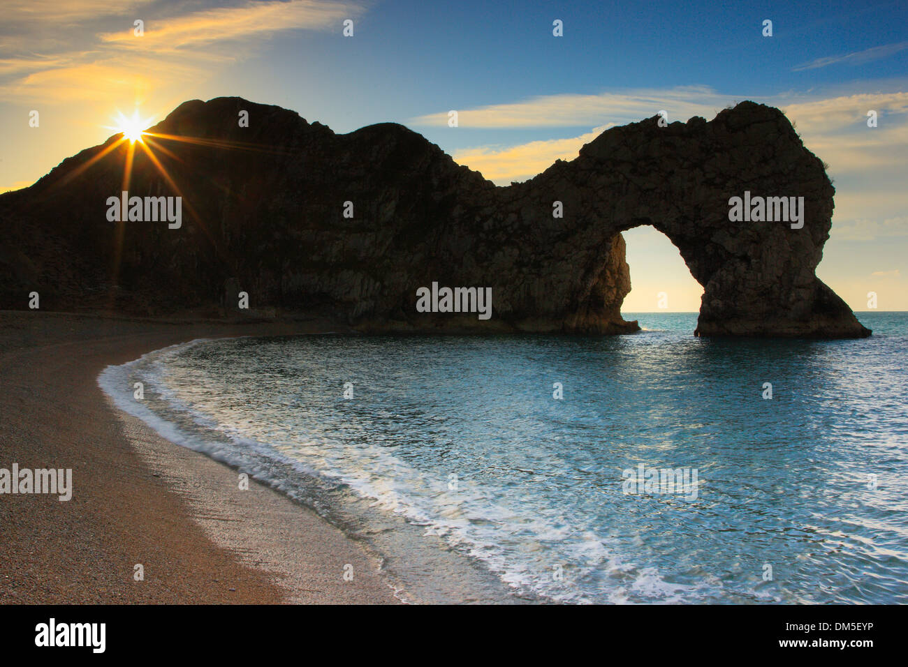 Arch bridge bay Dorset Durdle Door England Europe erosion rock cliff back light body of water Great Britain Jura Jurassic lime Stock Photo