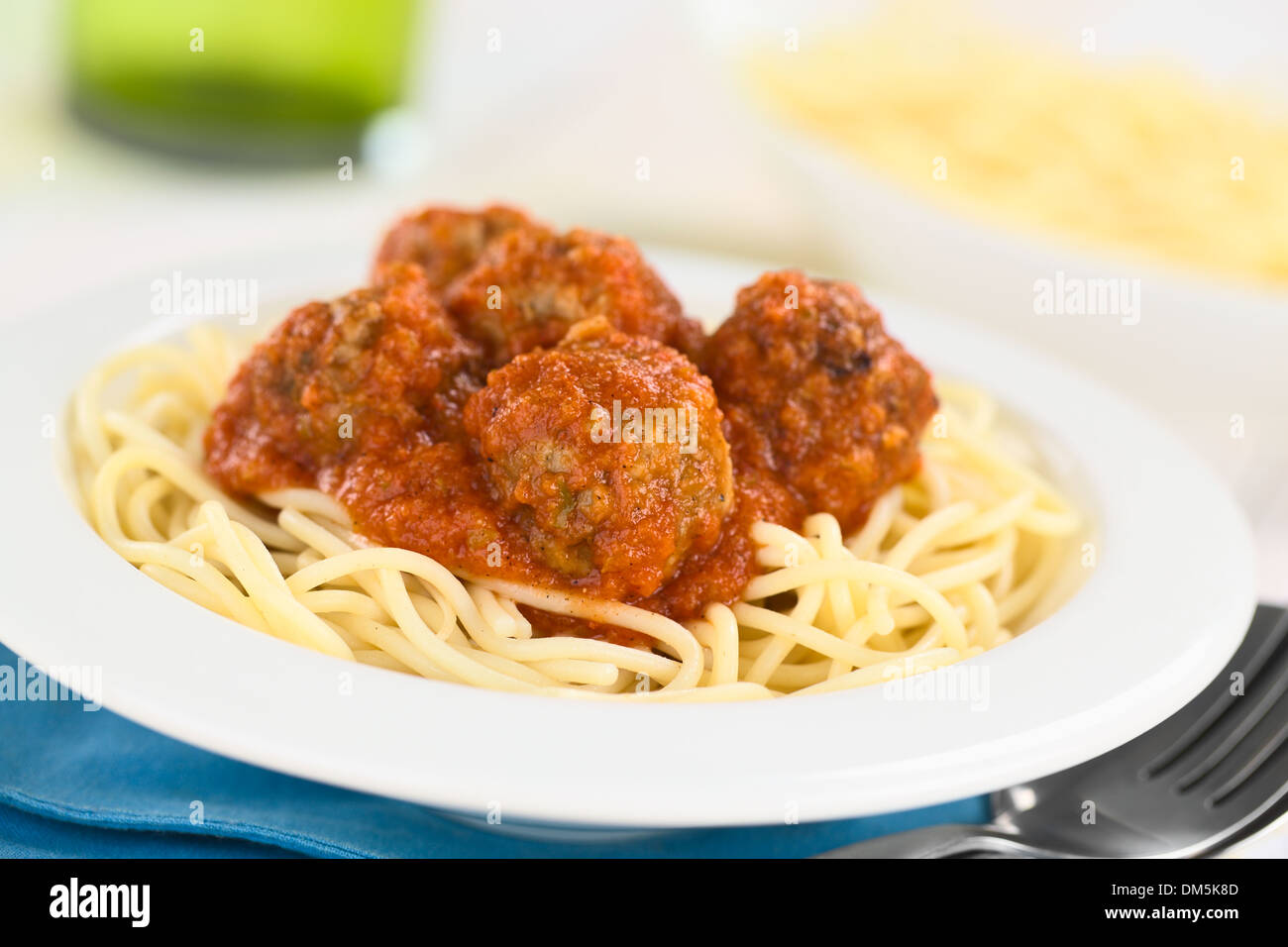 Spanish albondigas (meatballs) in tomato sauce on spaghetti served in
