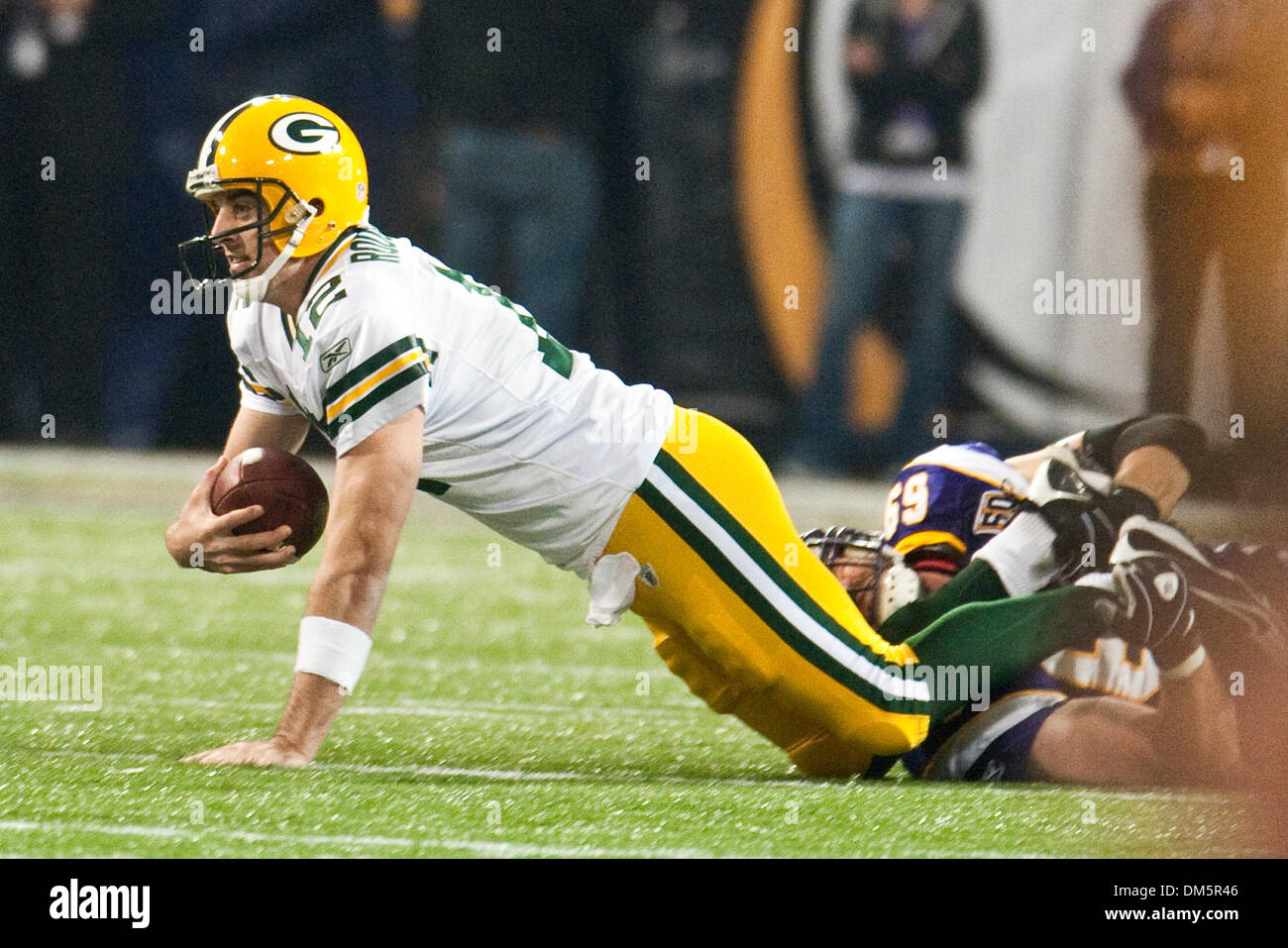 Nov. 21, 2009 - Minneapolis, Minnesota, United States of America - Green Bay Packers quarterback Aaron Rodgers (#12) is sacked by Minnesota Vikings defensive end Jared Allen (#69) during the game between the Green Bay Packers and the Minnesota Vikings at the Mall of America Field in Minneapolis, Minnesota.  The Packers defeated the Vikings 31-3. (Credit Image: © Marilyn Indahl/Sout Stock Photo