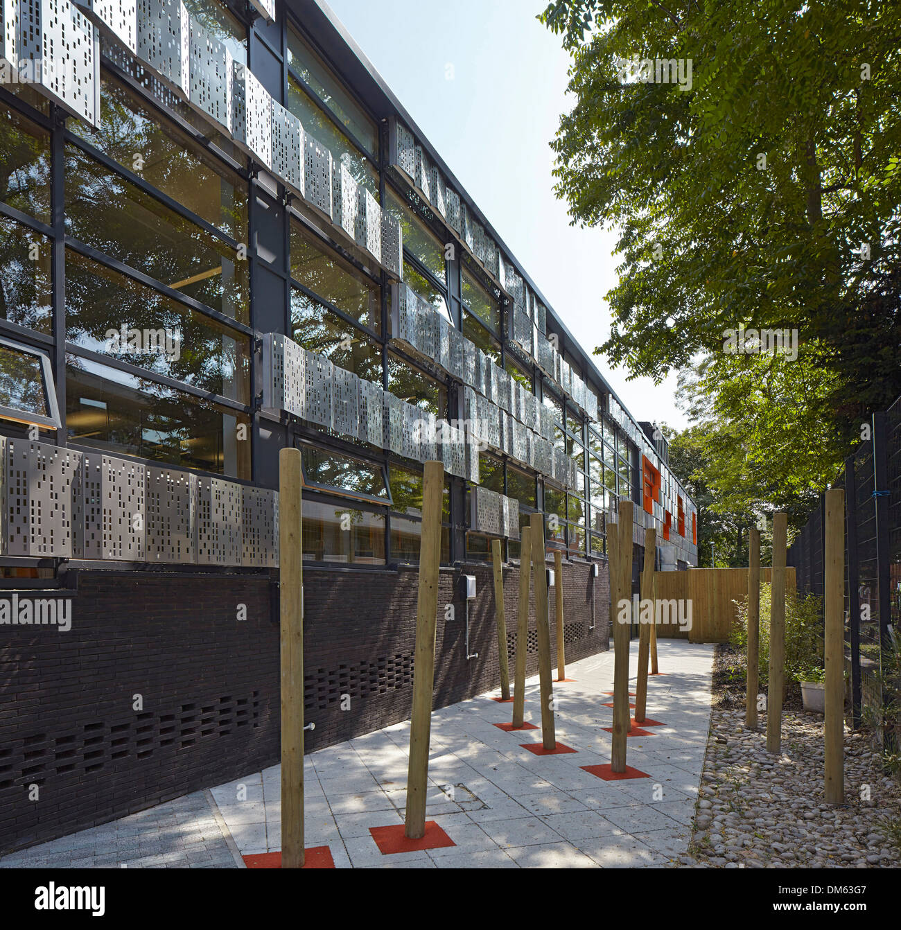 The Livity School, London, United Kingdom. Architect: Haverstock Associates LLP, 2013. Perspective of dark brick, stainless stee Stock Photo