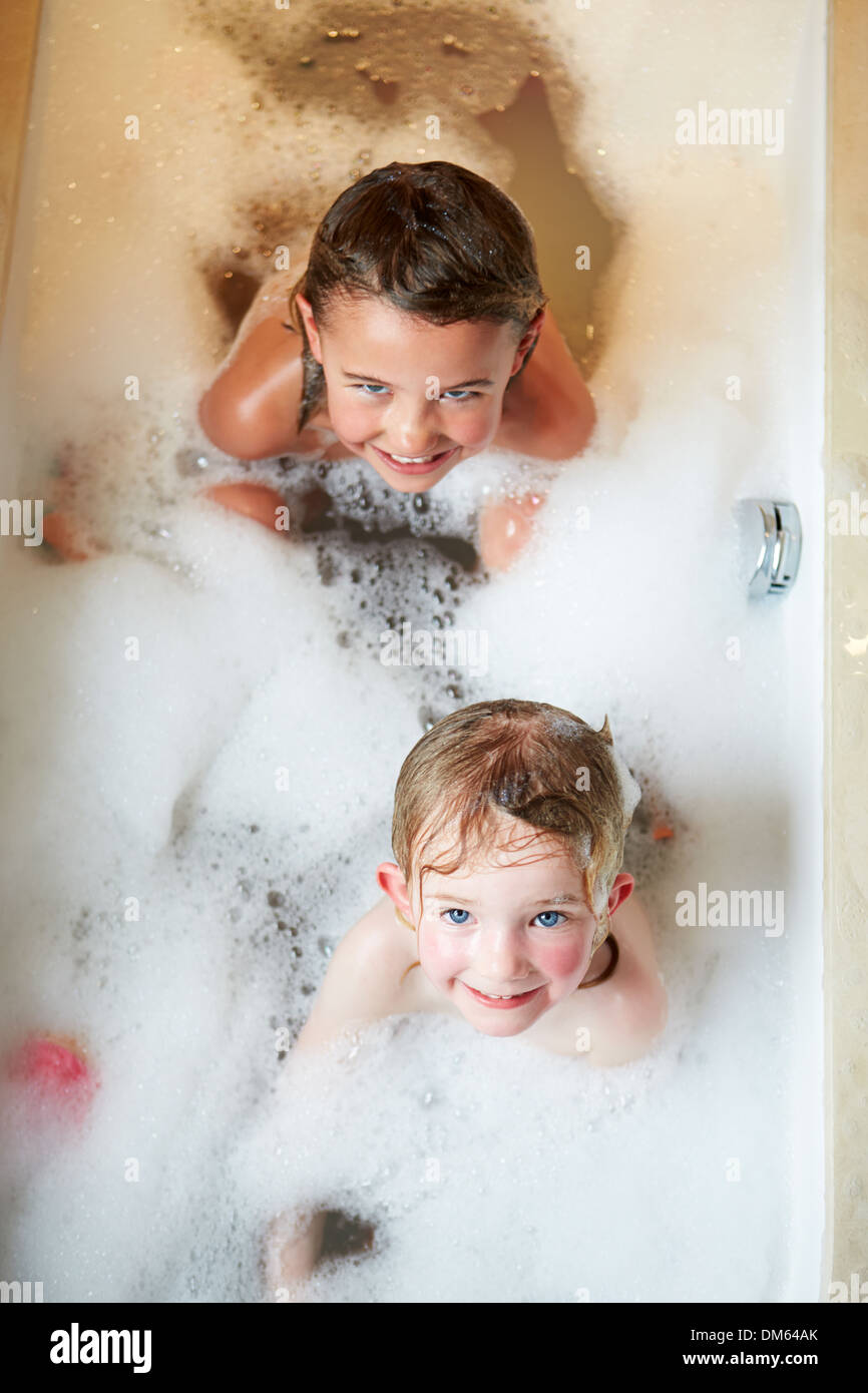 Overhead View Of Two Girls In Bath Stock Photo