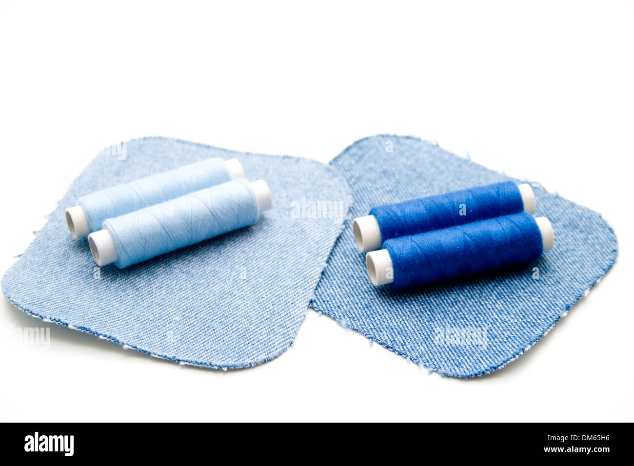 Sewing cotton with jeans patch Stock Photo Alamy