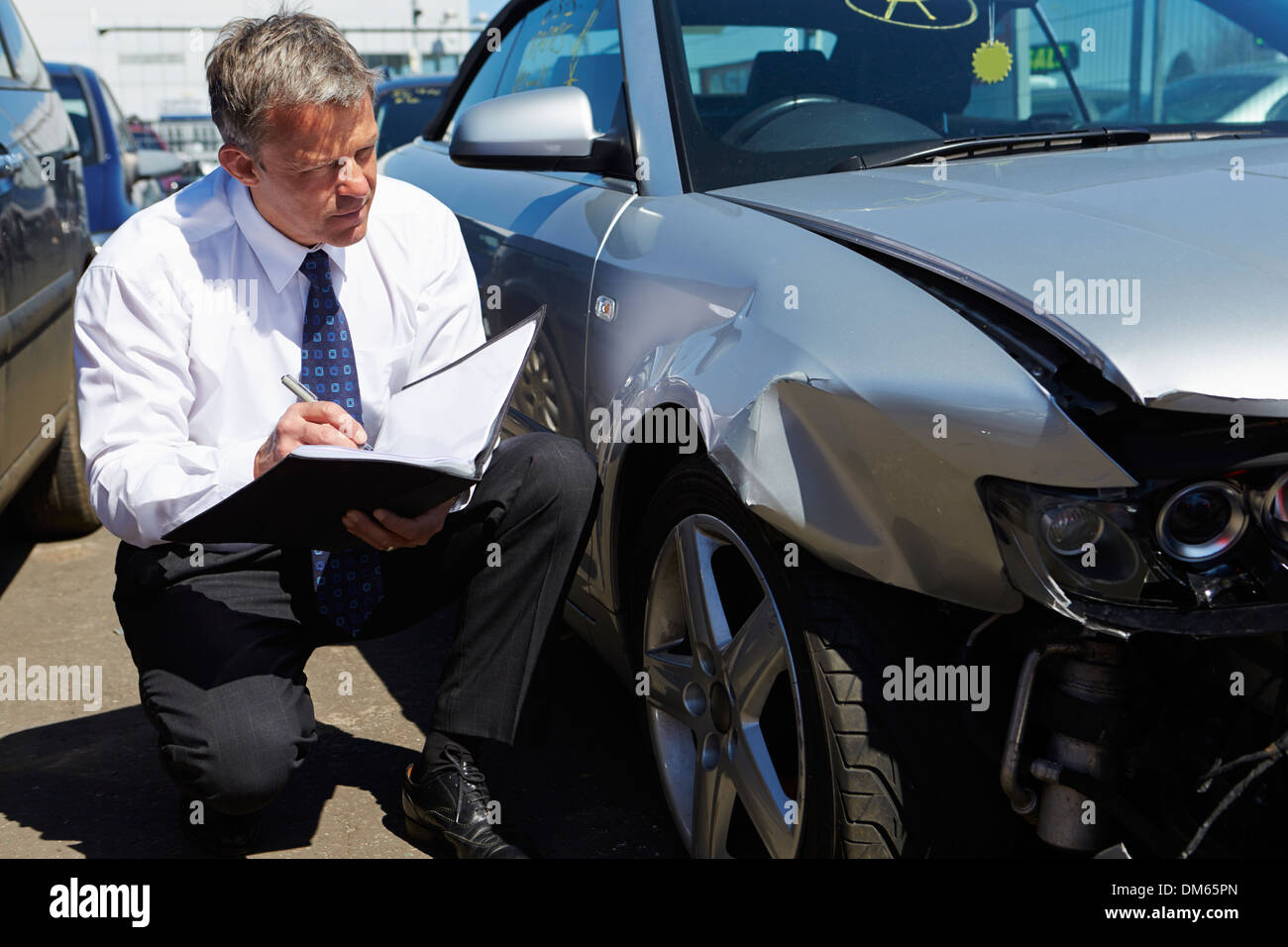 Loss Adjuster Inspecting Car Involved In Accident Stock Photo Alamy