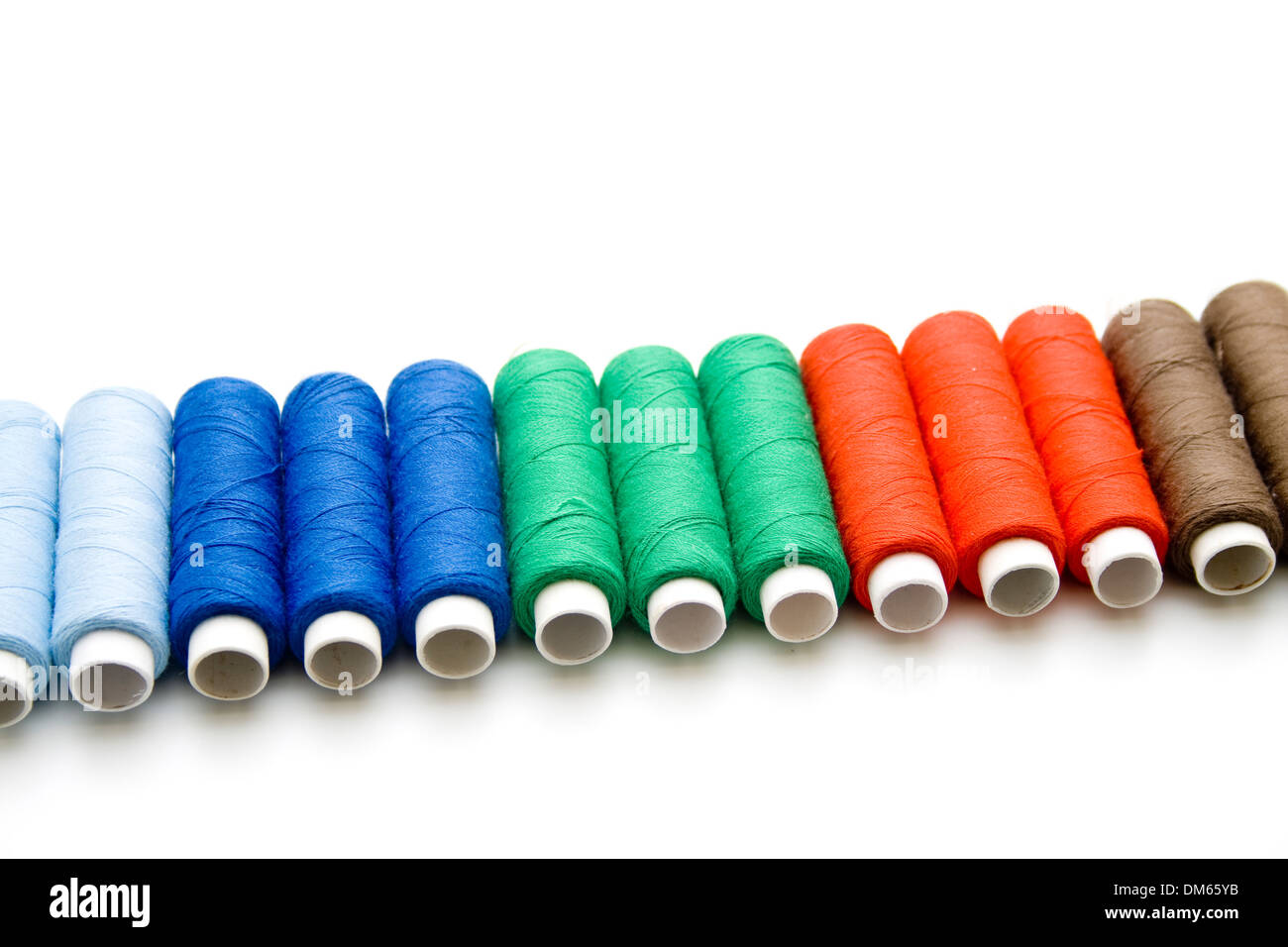 Coloured sewing cotton roles Stock Photo - Alamy