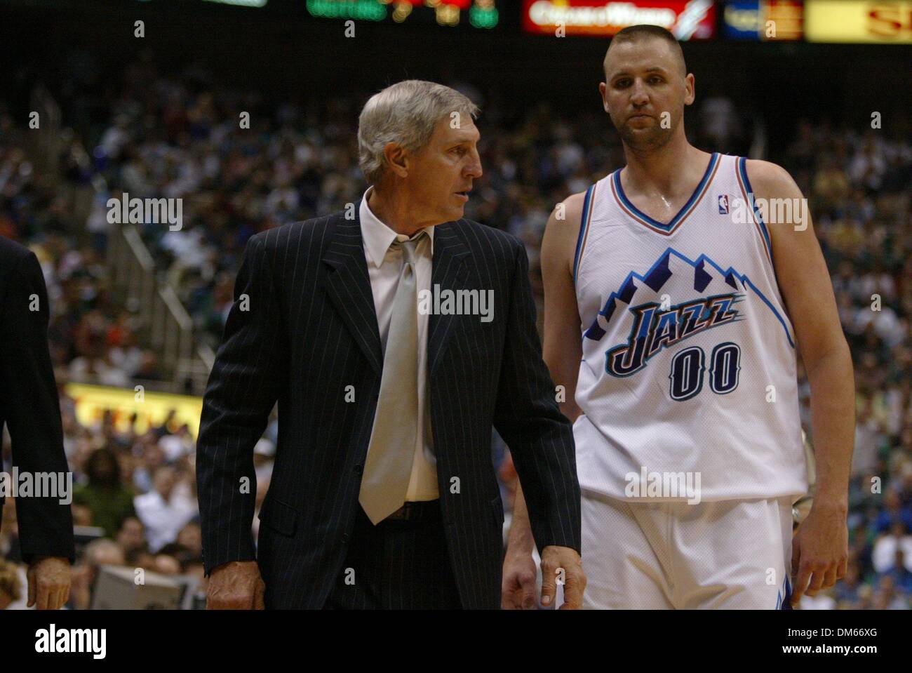Jerry Sloan is escourted off the court by Greg Ostertag after being thrown out of the game in the third quarter of game 3 in the Western conference Playoffs between the Sacramednto Kings and the Utah Jazz at the Delta Center, Salt Lake City, Utah, Saturday, April 26, 2003. Sacramento Bee photograph by Bryan Patrick/ZUMA Press Stock Photo