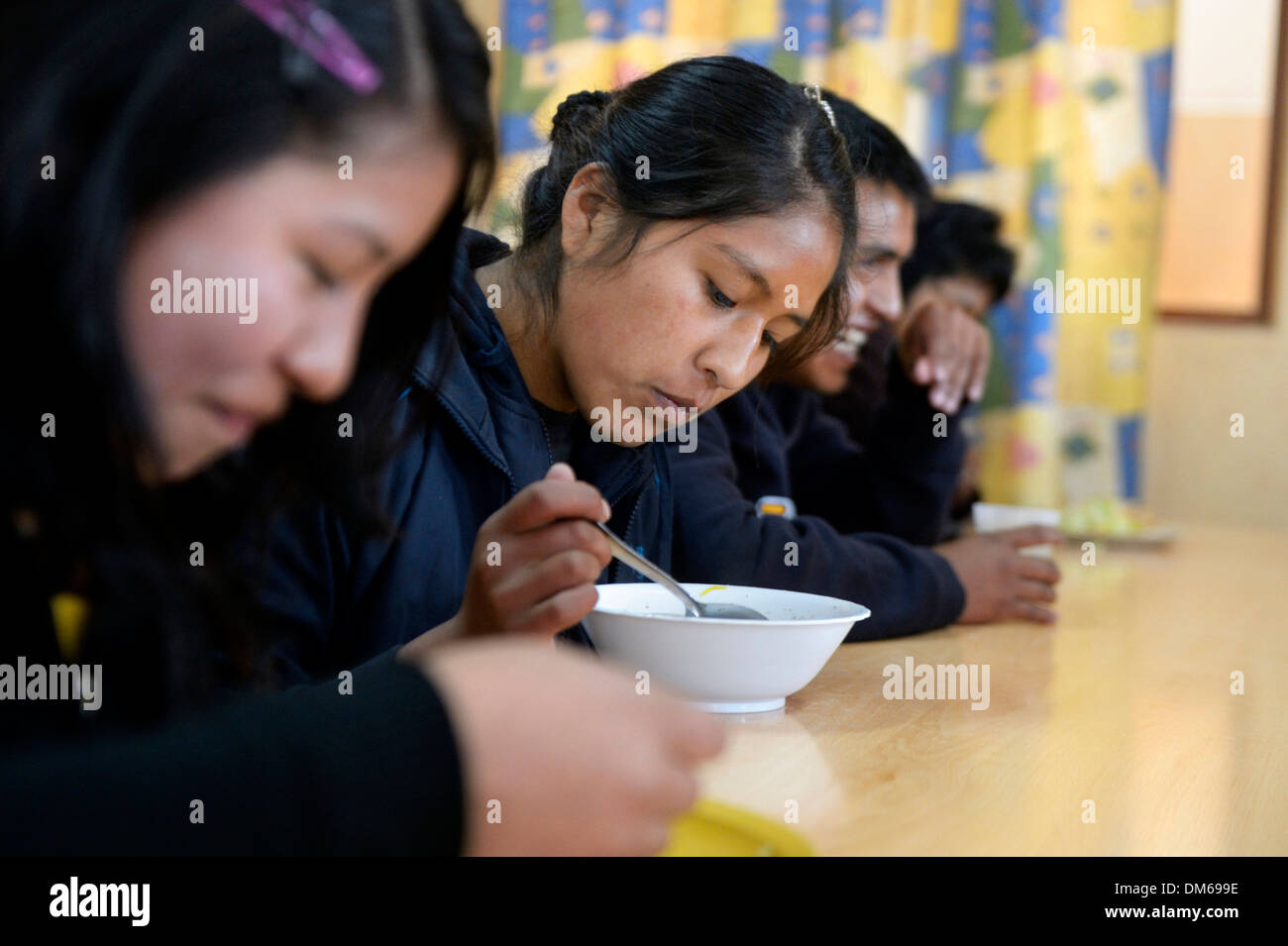 Teenagers eating in the cafeteria of their school, El Alto, Department of La Paz, Bolivia Stock Photo