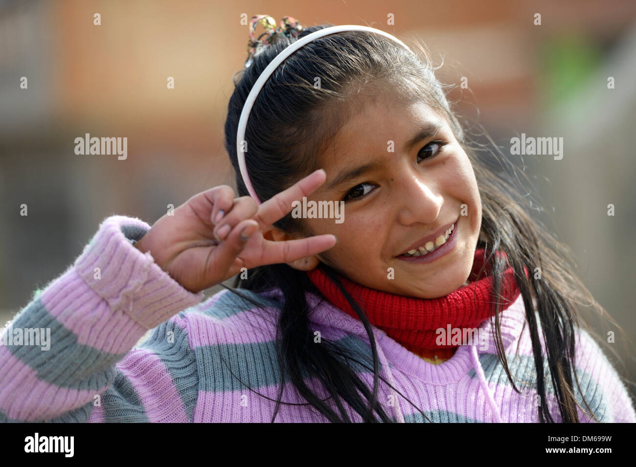Girl making the victory sign, El Alto, Department of La Paz, Bolivia Stock Photo