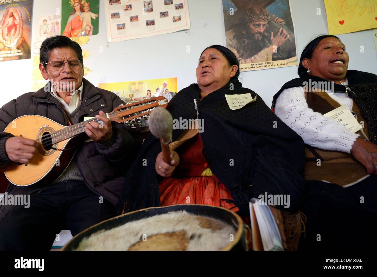 Catholic base community, Bolivians in the traditional dress of the Quechua Indians making music and singing together, El Alto Stock Photo