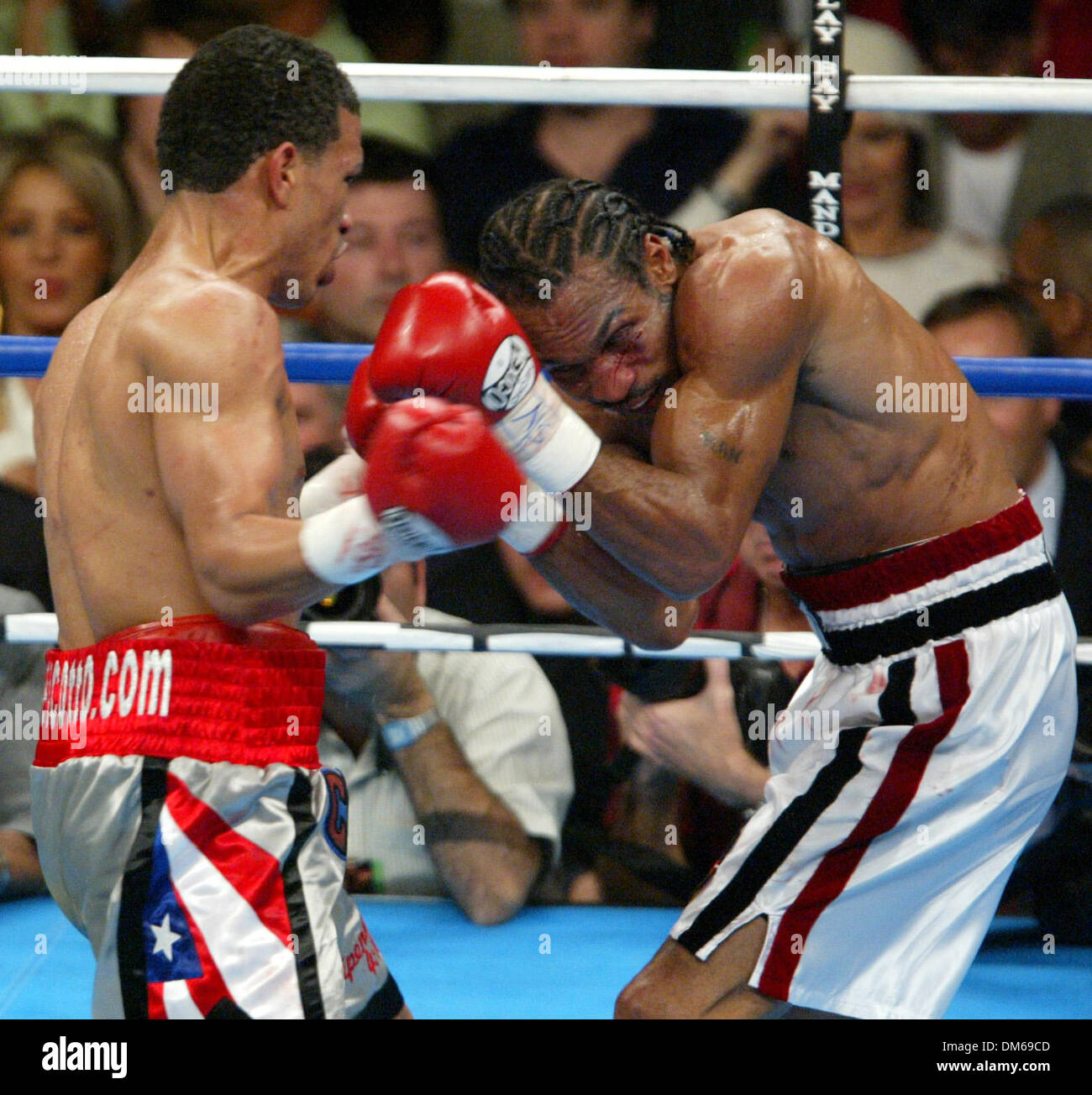 Dec 11, 2004; Las Vegas, NV, USA; WBO Junior Welterweight Champion MIGUEL COTTO (L) from Puerto Rico  on the attack against RANDALL BAILEY at the Mandalay Bay. Cotto retained his title  by TKO in the 6th round over Bailey. Stock Photo