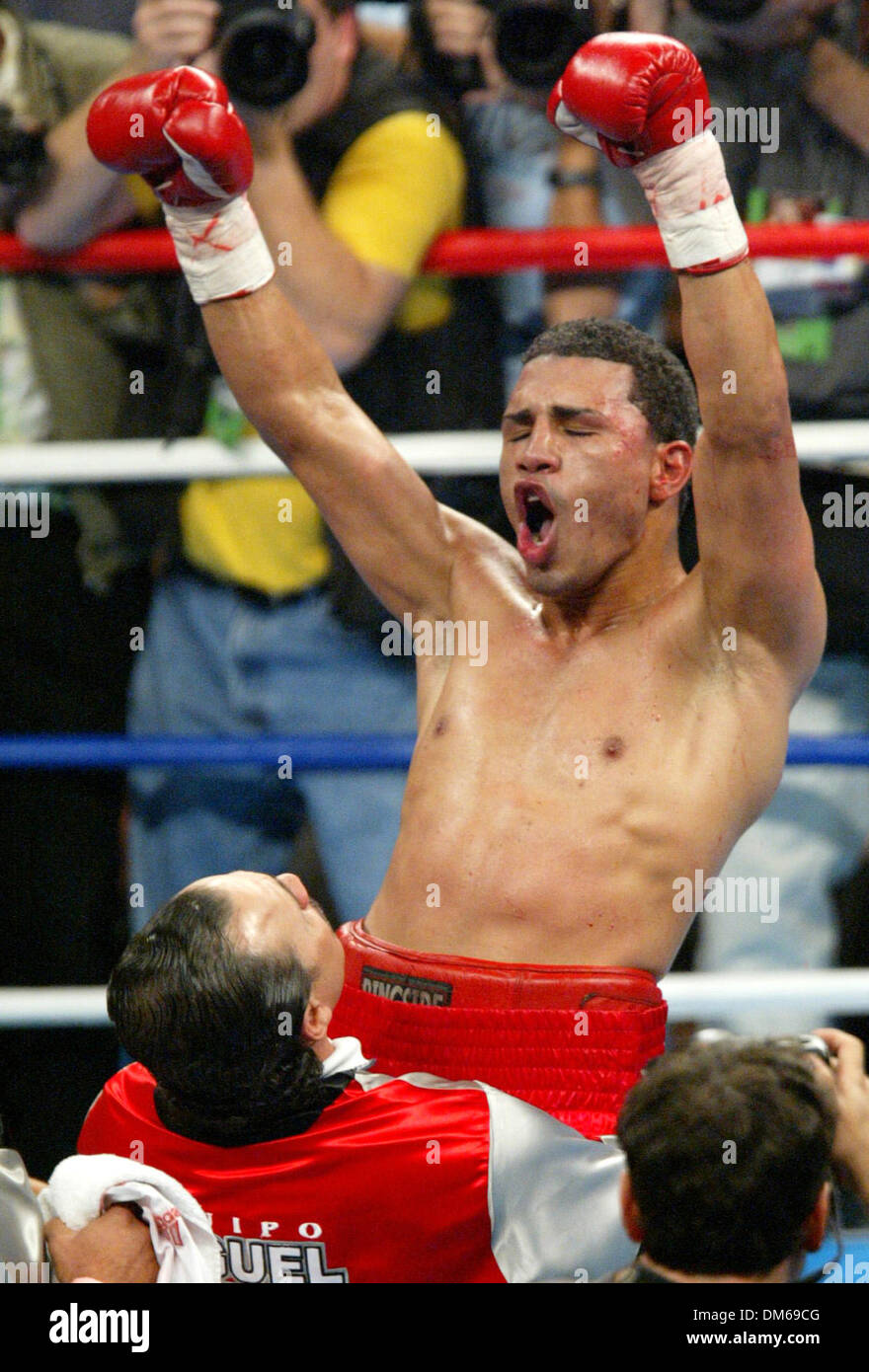 Dec 11, 2004; Las Vegas, NV, USA; WBO Junior Welterweight Champion MIGUEL COTTO (L) from Puerto Rico celebrates after beating Randall Bailey at the Mandalay Bay. Cotto retained his title  by TKO in the 6th round over Bailey. Stock Photo