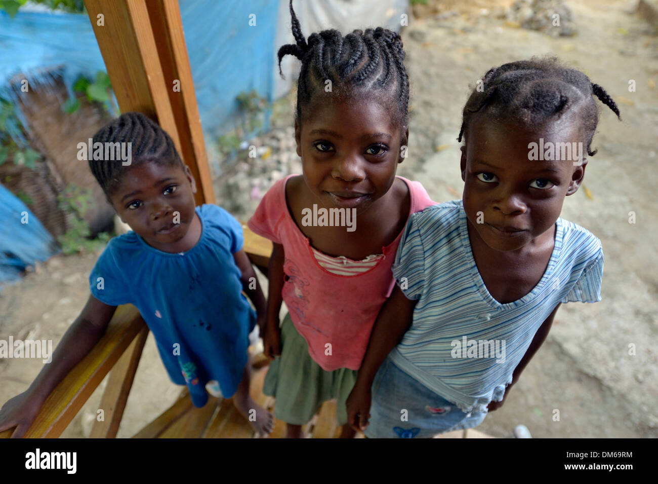 Three girls, two with cornrows, Tchawa, Leogane, Haiti Stock Photo