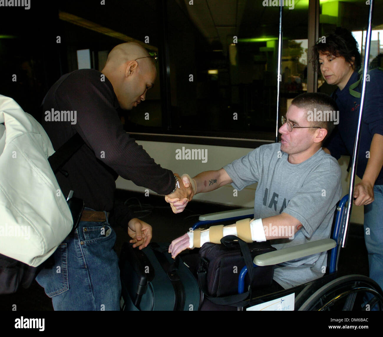 Jan 25, 2005; San Antonio , TX, USA; San Antonio boxer JESSE JAMES LEIJA greets U.S. Army Spc. SEAN BEVERIDGE, who was wounded in a suicide bombing in Iraq, at San Antonio International Airport on Tuesday, Jan. 25, 2005. Leija was on his way to Atlantic City, where he will face Arturo Gatti in a championship match. Beveridge was on his way home to Duvall, Wash. Stock Photo