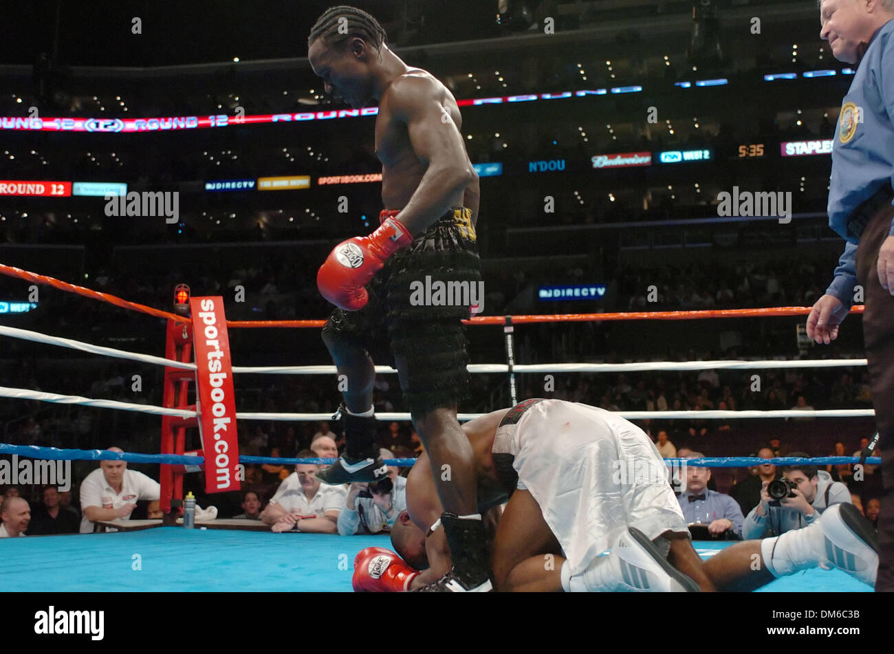 Feb 19, 2005; Los Angeles, CA, USA; LOVEMORE N'DOU knocks down JUNIOR WITTER (Witter went on to defeat N'Dou) in front of a sold-out crowd at The Staples Center. Stock Photo