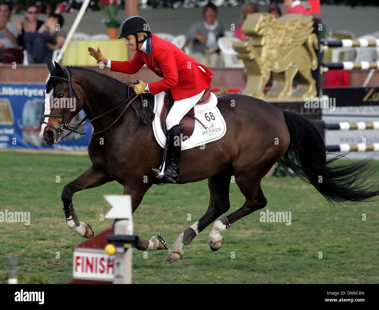 Feb 20, 2005; Wellington, FL, USA; ANNE KURSINSKI pats her horse Roxana