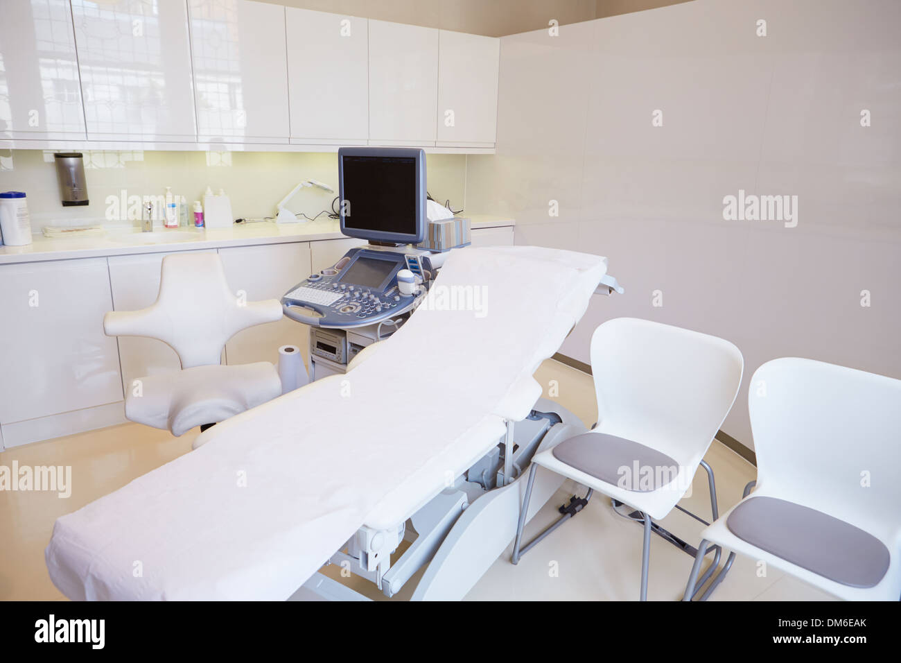 Empty Ultrasound Suite In Modern Hospital Stock Photo