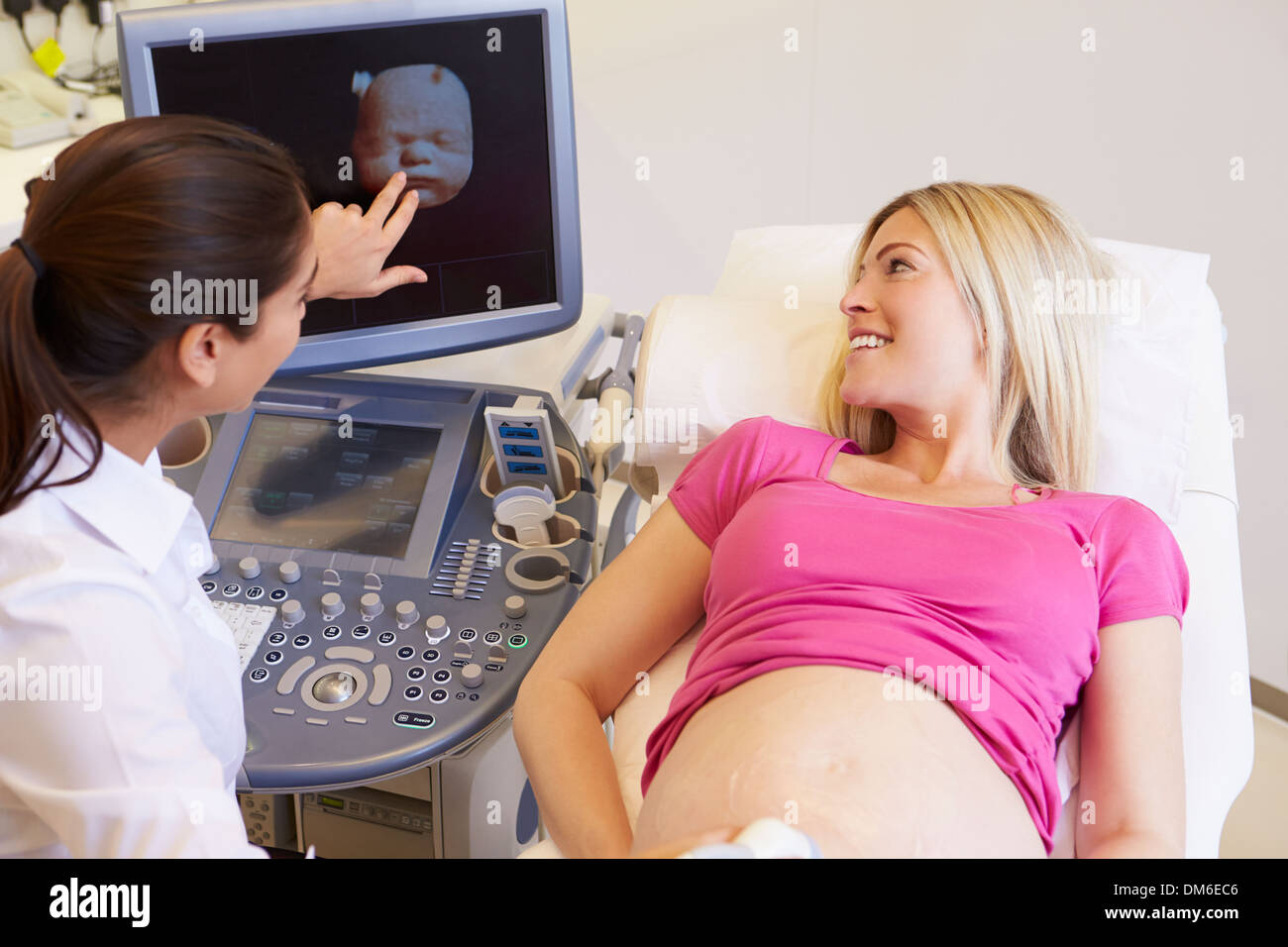Pregnant Woman Having 4D Ultrasound Scan Stock Photo