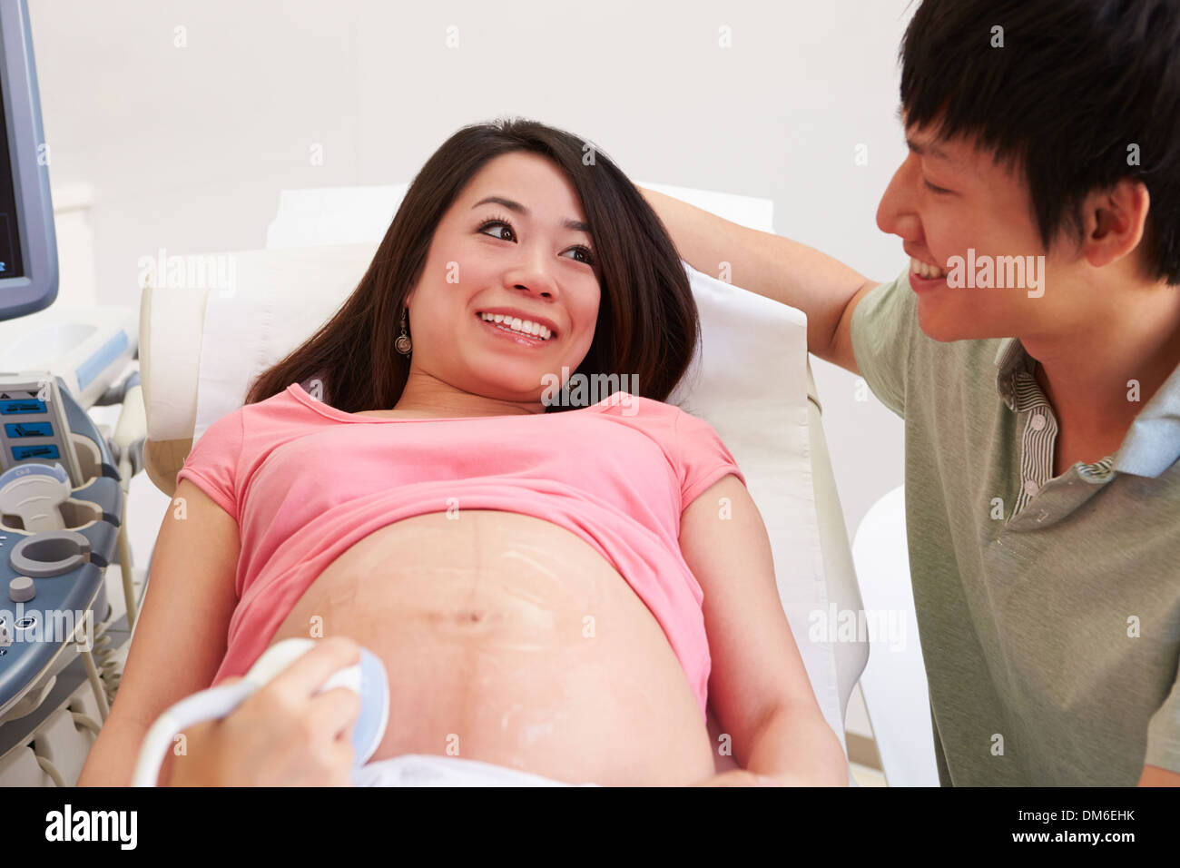 Pregnant Woman And Partner Having 4D Ultrasound Scan Stock Photo
