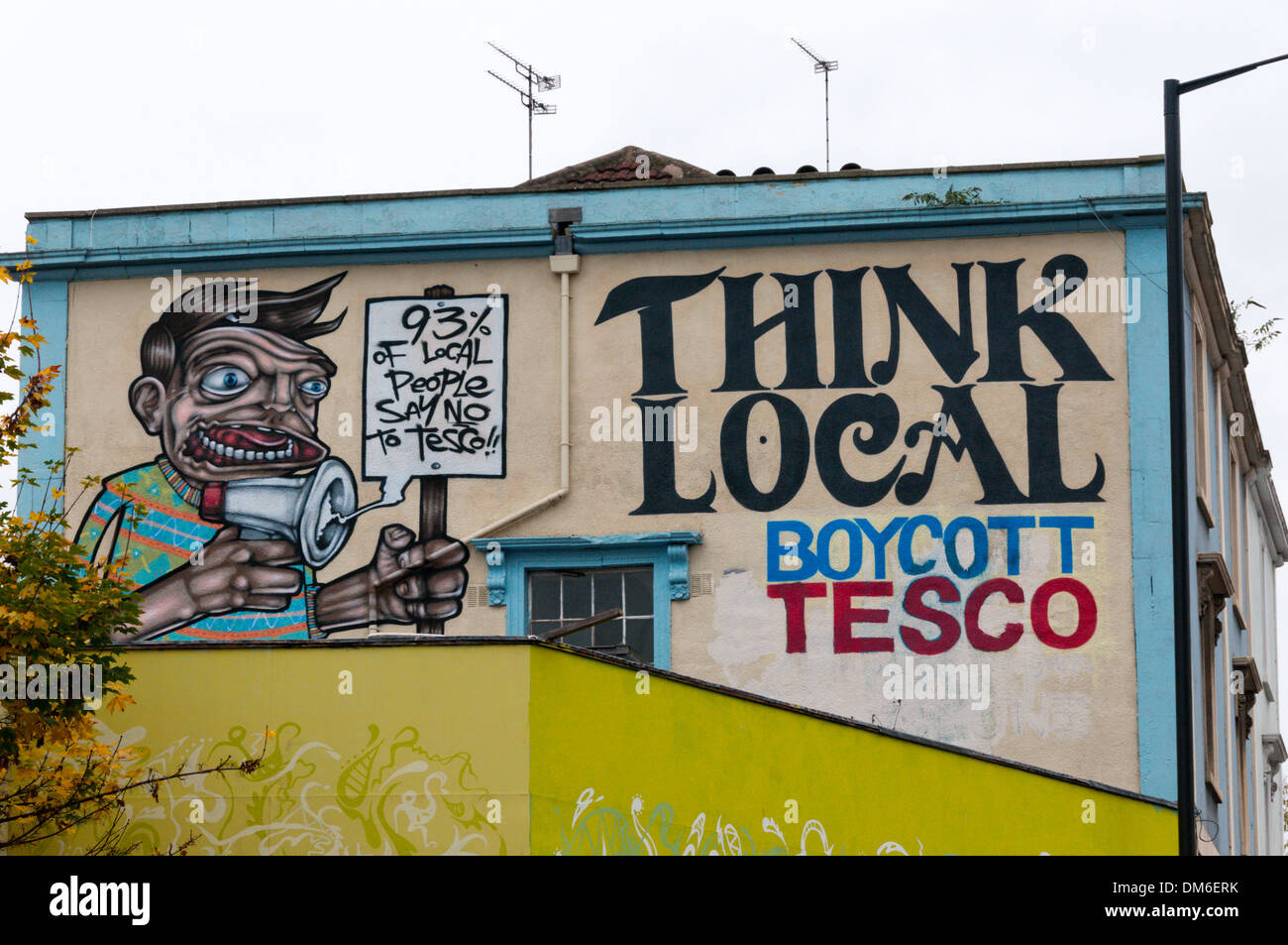 Think Local Boycott Tesco slogan on wall in Stokes Croft area of Bristol. Stock Photo