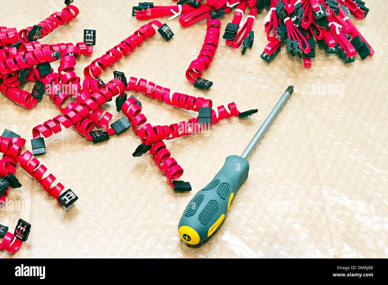 background of many serial ATA cables coiled Stock Photo
