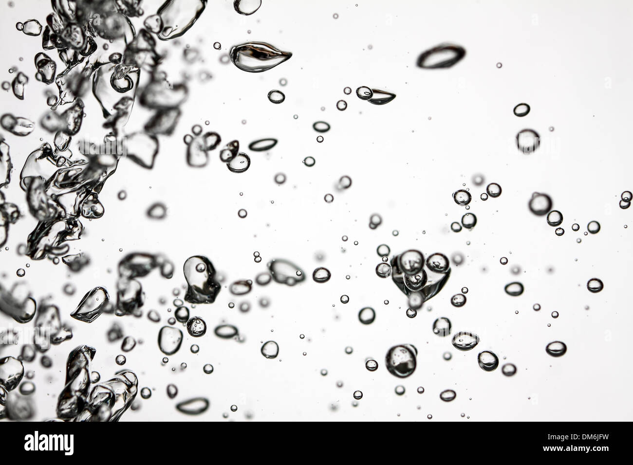 bubbles of oxygen rising through clear water Stock Photo