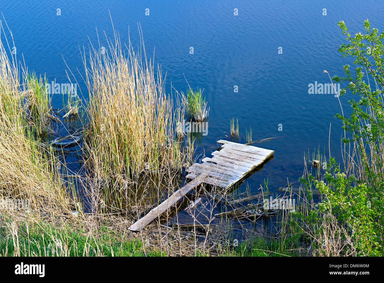 homemade wooden platform on the river Stock Photo