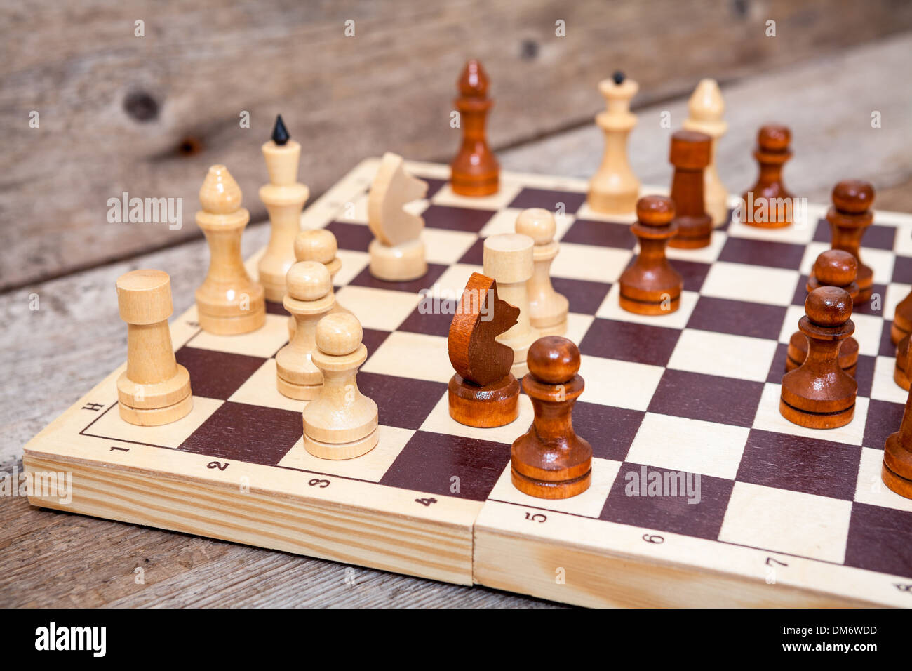 Unfinished Chess Game On Wooden Board Stock Photo - Alamy