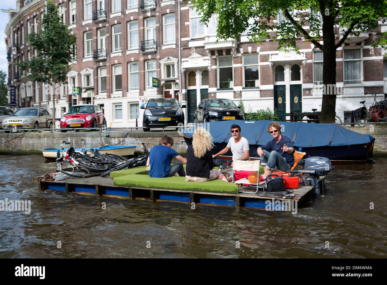 small boats in Amsterdam canal Stock Photo Alamy