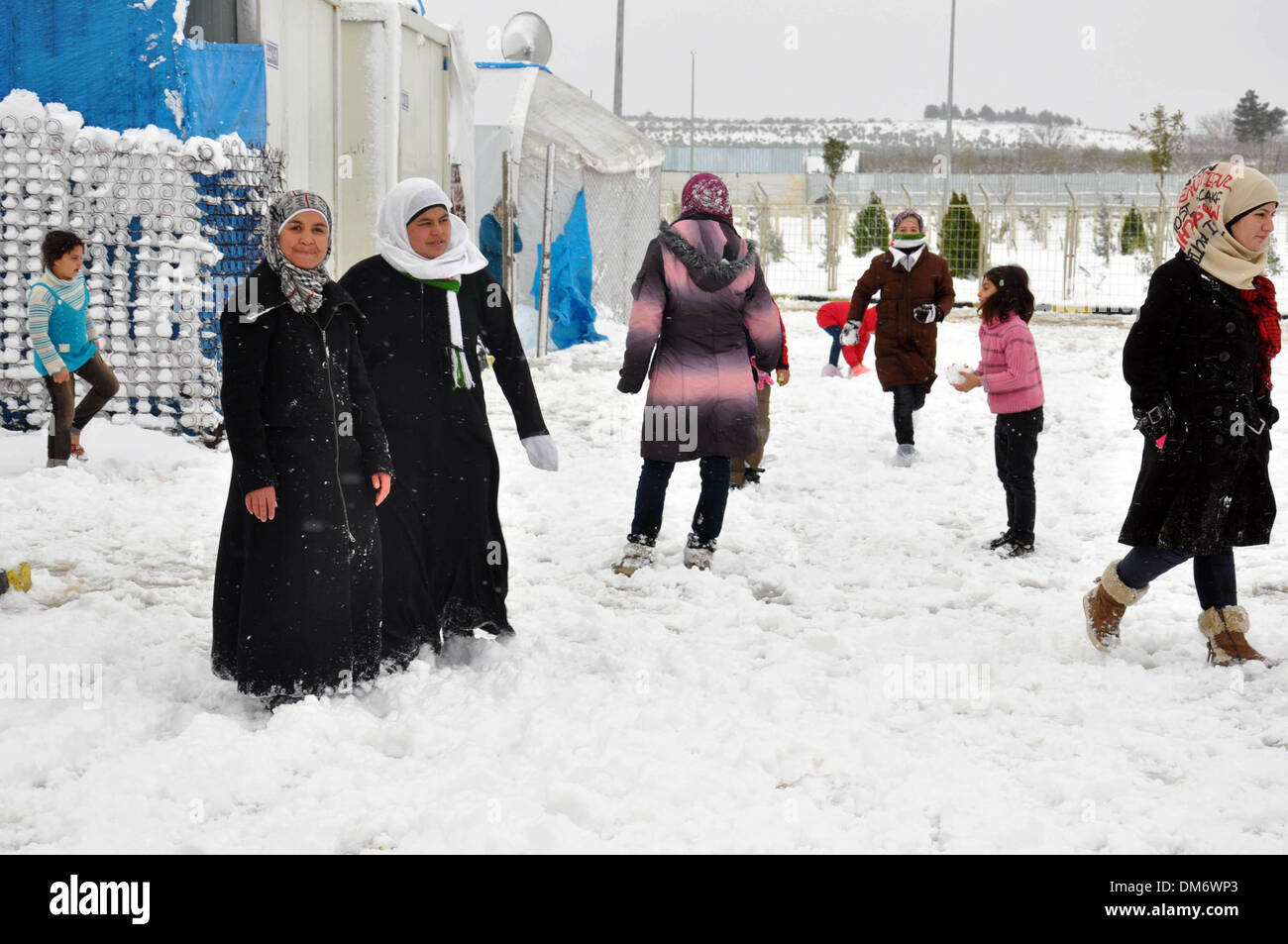 Kilis, Turkey. 12th Dec, 2013. Syrian refugees are seen at a refugee camp in Kilis province, Turkey, Dec. 12, 2013. Heavy snowfall across Turkey hit Syrian refugee camps in Kilis as well. Credit:  Mert Macit/Xinhua/Alamy Live News Stock Photo