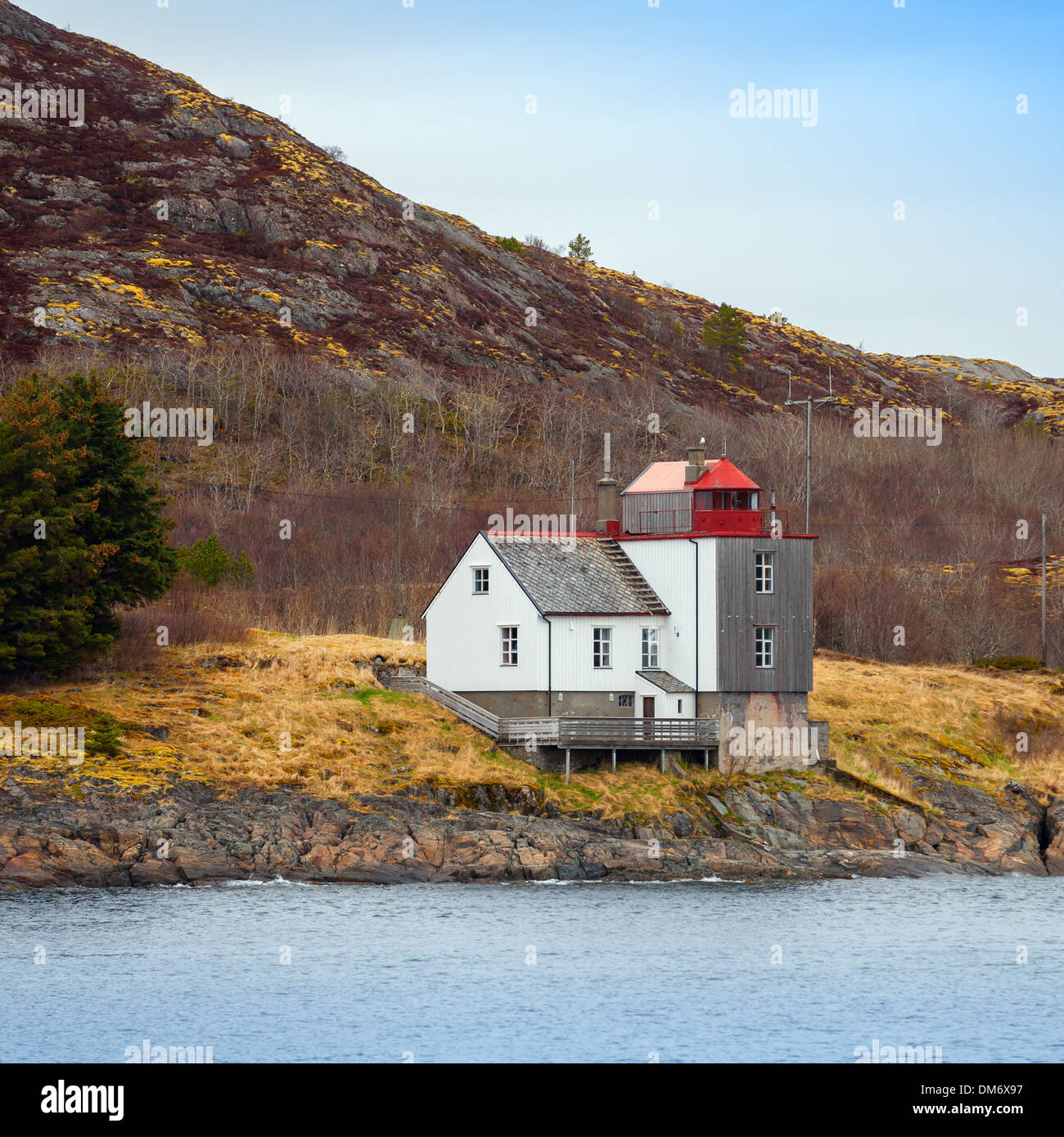 Old Norwegian Lighthouse stands on the seacoast Stock Photo