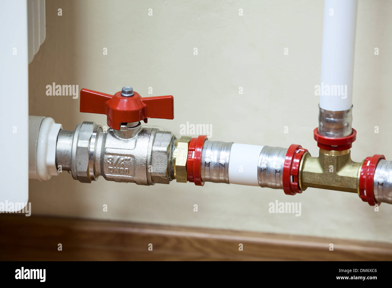 Fittings and PVC pipelines of central heating radiator Stock Photo Alamy