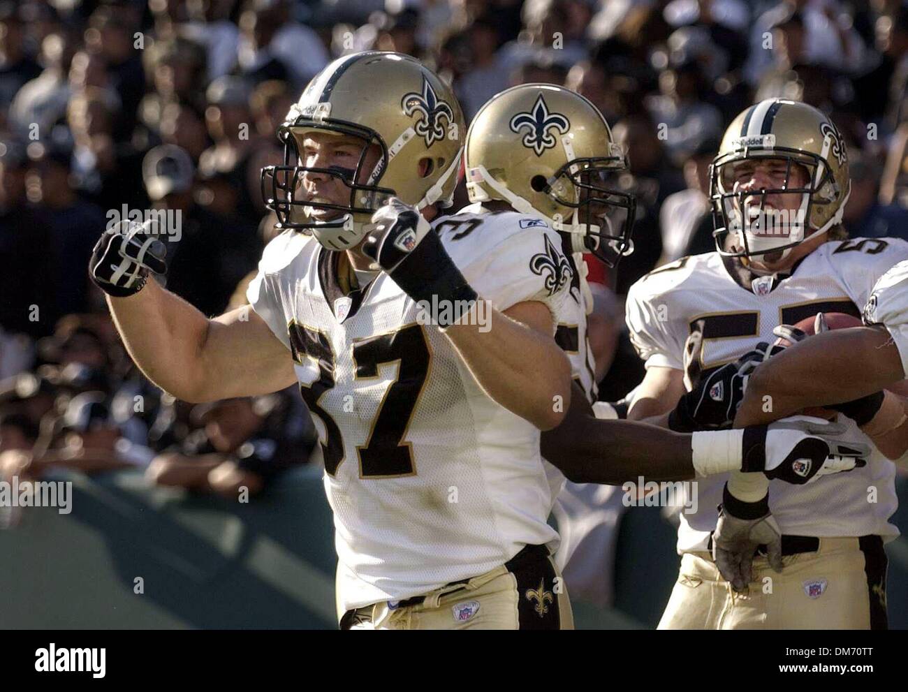 New Orleans Saints Steve Gleason 37, and Colby Bockwoldt 57 who recovered Oakland Raiders Carlos Francis fumble for a New Orleans touchdown in the 4th quarter celebrate in the endzone at Network Associates Coliseum Sunday  October 25, 2004 in Oakland, California.  The Saints won 31-26. Sacramento Bee Photo /  Paul Kitagaki Jr./ZUMA Press Stock Photo