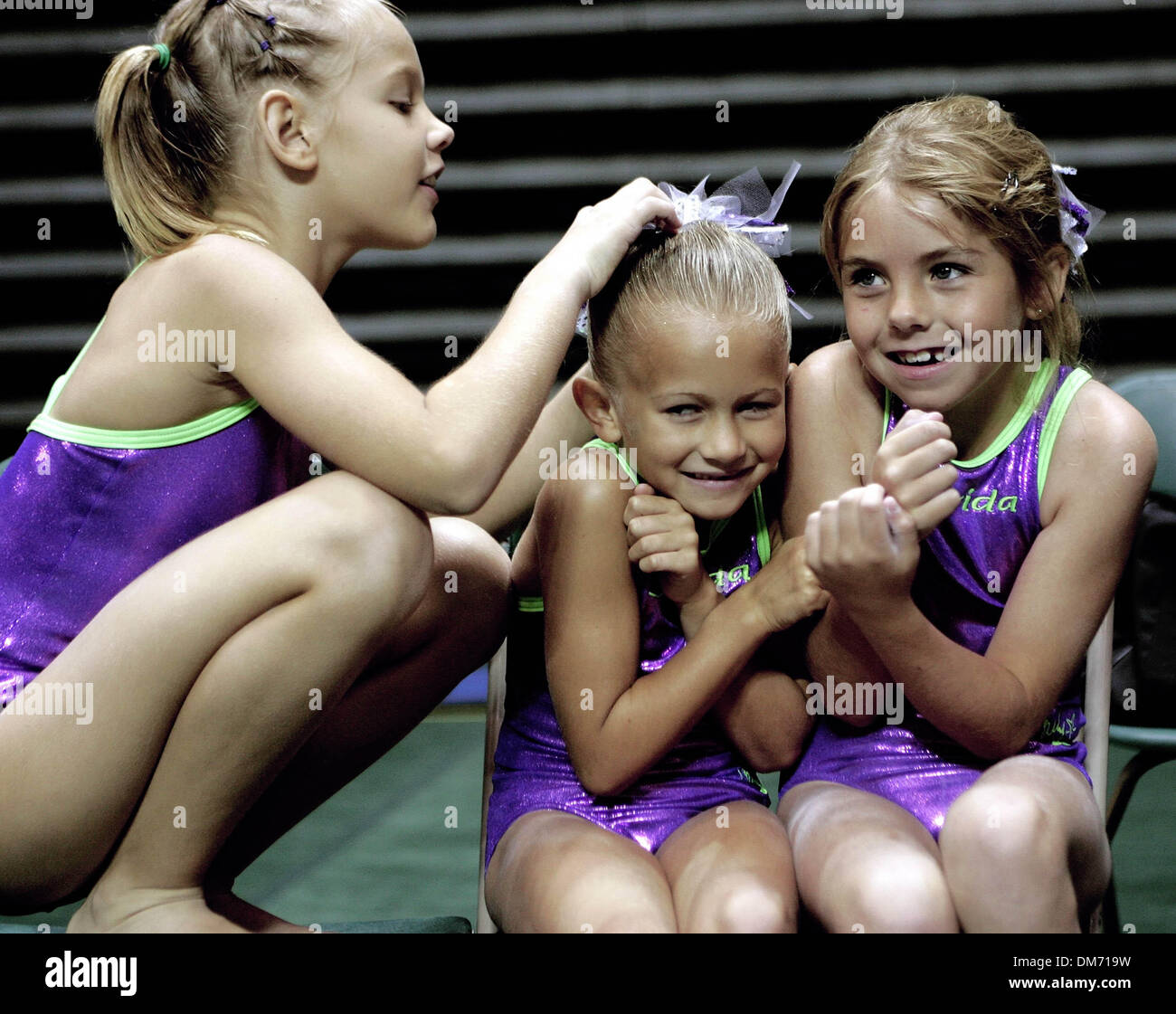 Jun 11, 2005; Orlando, FL, USA; "Stop touching my hair, you're messing it  up!" said Taylor Boykin, 7, of Port St. Lucie, center, as Gabbie Salomon,  7, of Fort Pierce, left, examined
