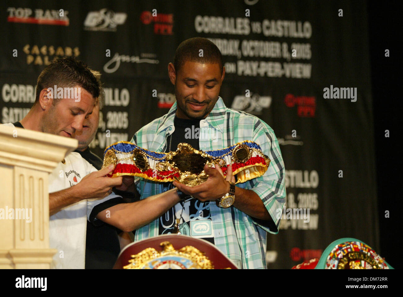 Jul 20, 2005; Las Vegas, NV, USA; Former Jr Bantamweight Champion WAYNE MCCULLOUGH presents DIEGO CORRALES with the most prestigous belt a fighter can receive, The Ring Magazine Belt. The Ring belt means that a fighter is the best in the World in his weight class.  The Ring Belt was presented at The 'Uno Mas' One More Time Press conference at Caesars Palace Hotel & Casino. CORRALES Stock Photo