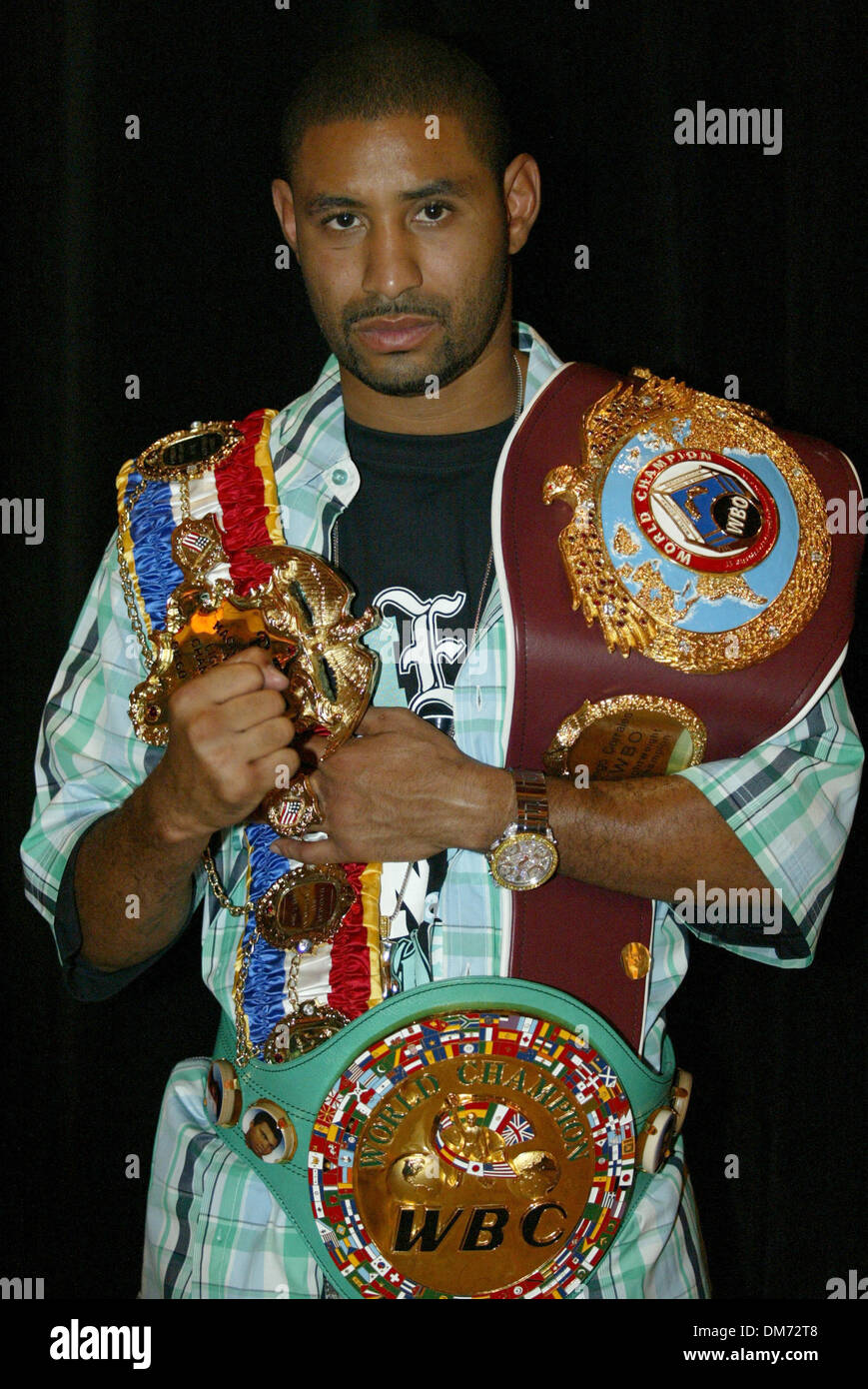 Jul 20, 2005; Las Vegas, NV, USA; DIEGO 'CHICO' CORRALES poses with all his three Championship belts at The 'Uno Mas' One More Time Press conference at Caesars Palace Hotel & Casino. Former Jr Bantamweight Champion Wayne McCullough presented CORRALES with the most prestigous belt a fighter can receive, The Ring Magazine Belt for being the best in the World in his weight class. Corr Stock Photo