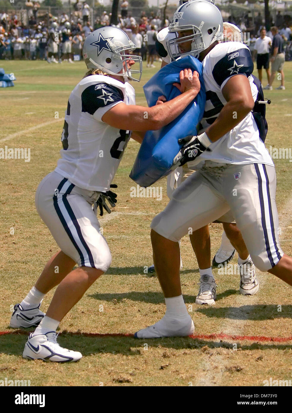 Aug 06, 2005; Oxnard, CA, USA; Dallas Cowboys tight end Dan Campbell, left,  suited-up and ran through drills with the team for the first time during  training camp Saturday afternoon Aug. 6,