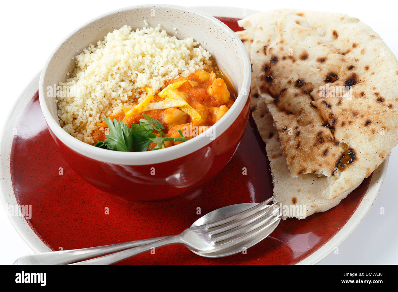 Moroccan style chickpea and tomato soup with plain couscous Stock Photo