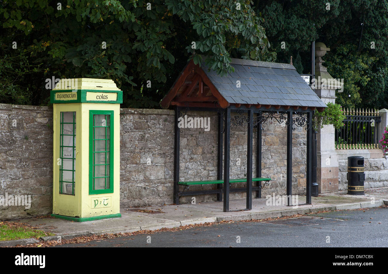 Old style Irish telephone box, bus shelter in small village in rural Ireland. Stock Photo