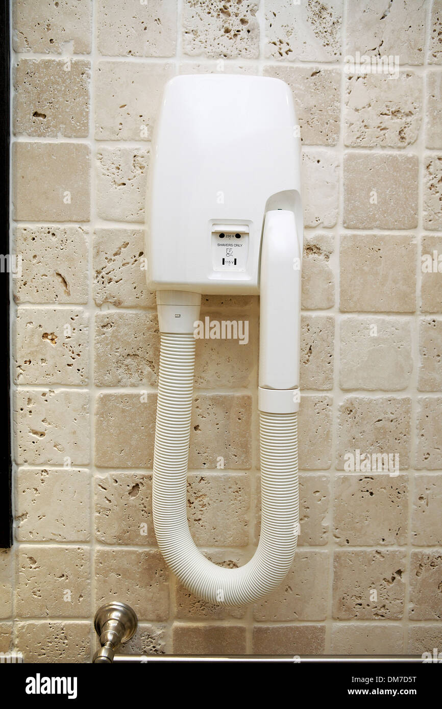 close up of wall mounted hairdryer with shaver socket in a french hotel  bathroom. paris, france, europe Stock Photo - Alamy