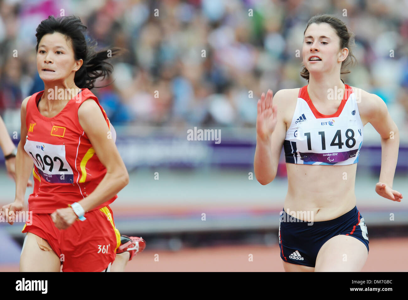 Dezhi Xiong (CHN) and Olivia Breen (GBR) London 2012 Paralympic Games - Women's 100m - T38 Round - Heat 2 - Olympic Stadium Stock Photo